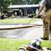 Firefighter contain the scene of an explosion at a house on Gattegno Street in Ypsilanti Township on Sunday, July 7. Daniel Brenner I AnnArbor.com